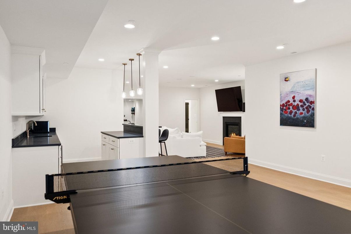 Fireplace, Game Room, Interior, Pendant Lights, Recessed Lighting, Wood Texture Flooring