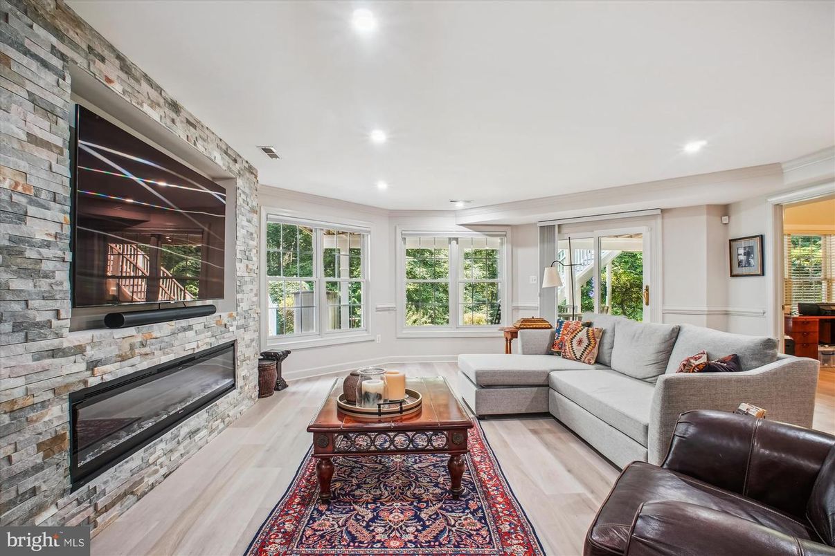 Fireplace, Interior, Living room, Recessed Lighting, Stone Walls, Wood Texture Flooring