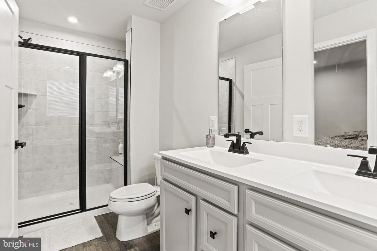 Bathroom, Dual Sink Vanities, Glass Shower, Interior, Recessed Lighting, Wood Texture Flooring