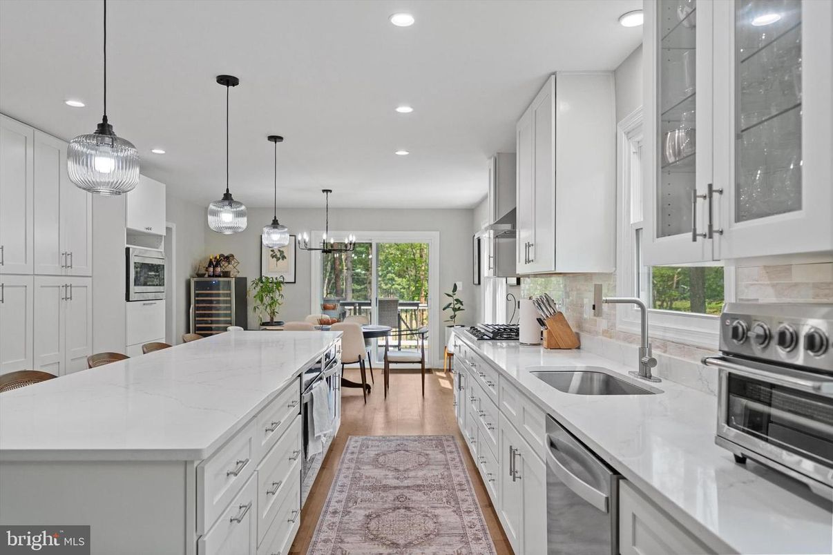 Dining room, Interior, Kitchen, Pendant Lights, Recessed Lighting, Stainless Steel Appliances, Wood Texture Flooring
