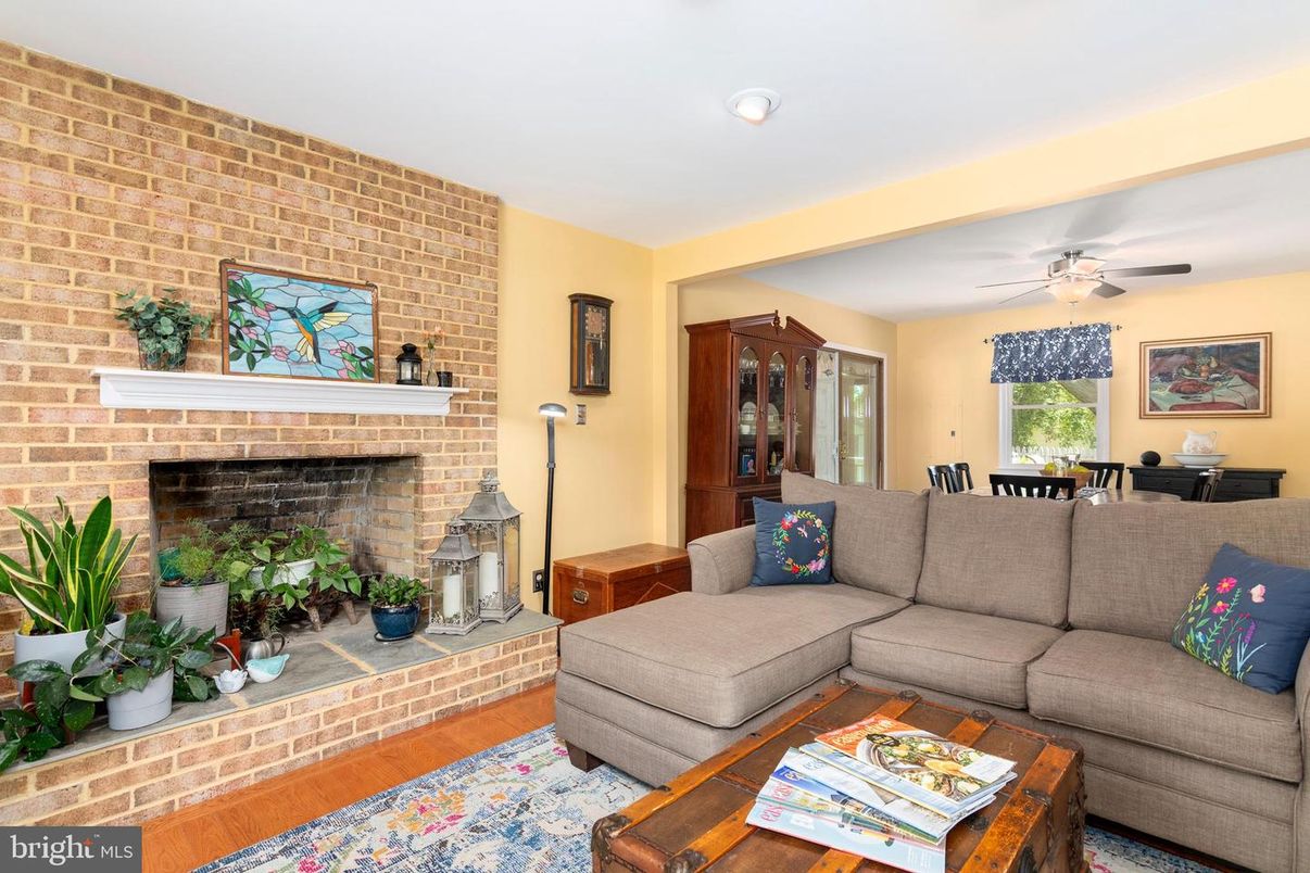 Dining room, Fireplace, Interior, Living room, Recessed Lighting, Stone Walls, Wood Texture Flooring