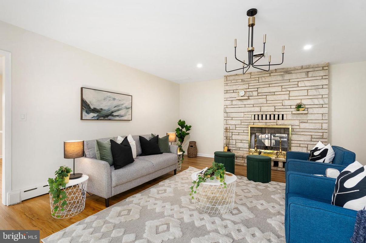 Chandelier, Fireplace, Interior, Living room, Recessed Lighting, Stone Walls, Wood Texture Flooring