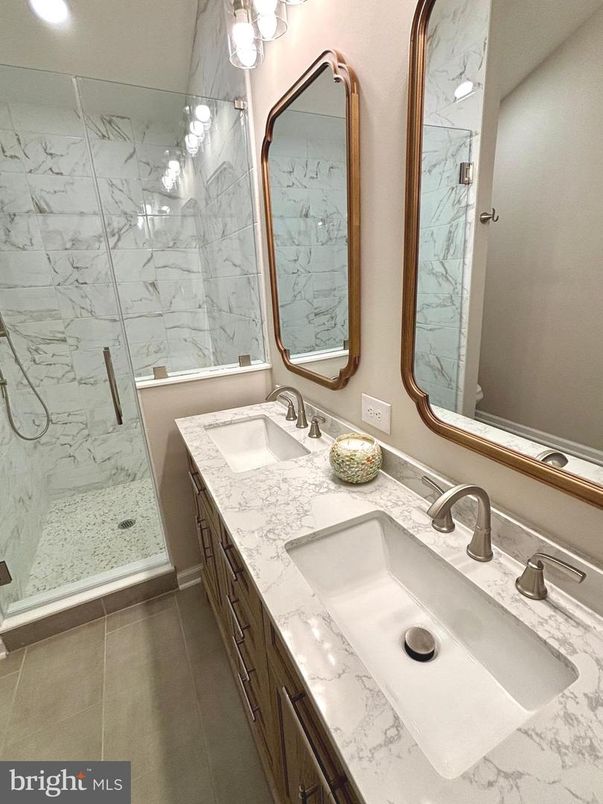 Bathroom, Dual Sink Vanities, Glass Shower, Interior, Marble Walls, Recessed Lighting