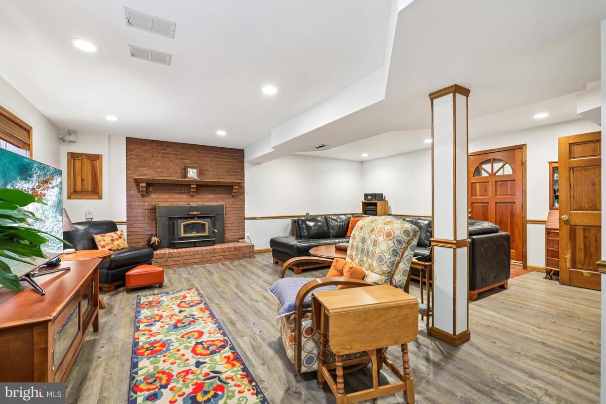 Fireplace, Interior, Living room, Recessed Lighting, Stone Walls, Wood Texture Flooring