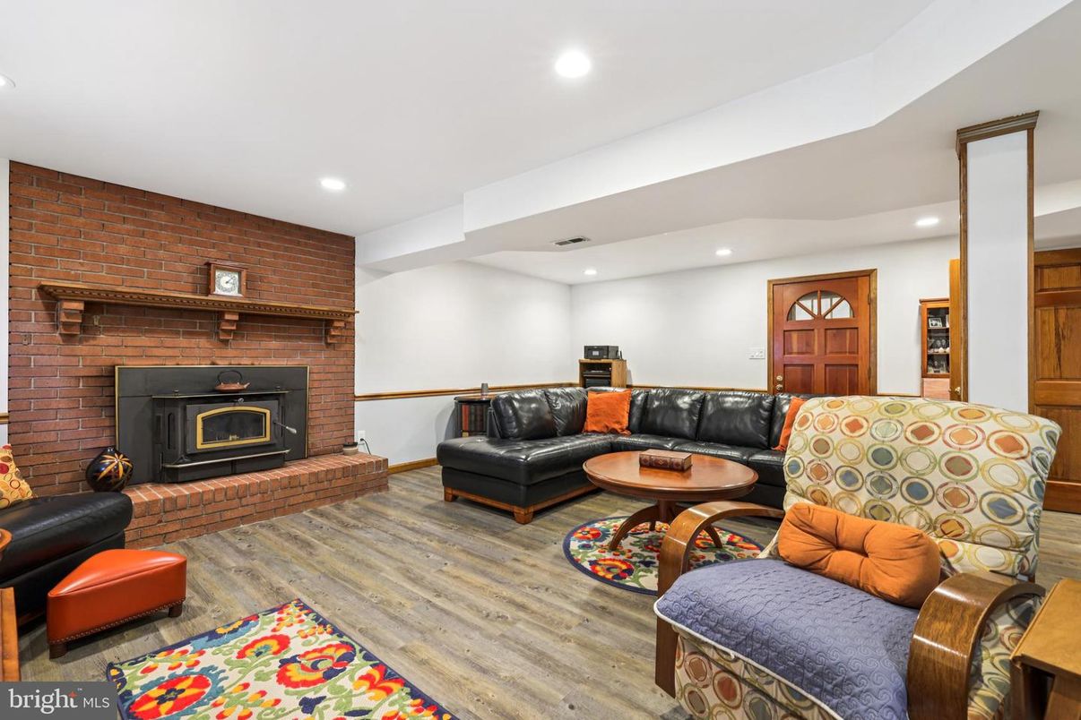 Fireplace, Interior, Living room, Recessed Lighting, Stone Walls, Wood Texture Flooring