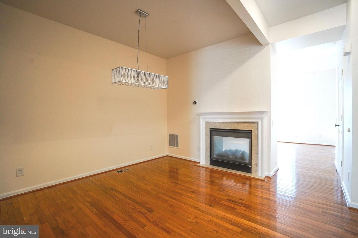 Empty room, Fireplace, Interior, Pendant Lights, Wood Texture Flooring