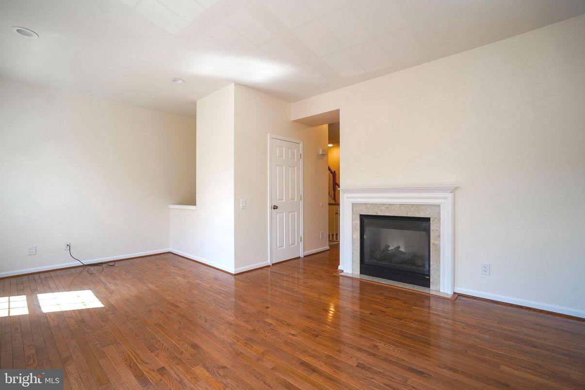 Empty room, Fireplace, Interior, Recessed Lighting, Wood Texture Flooring