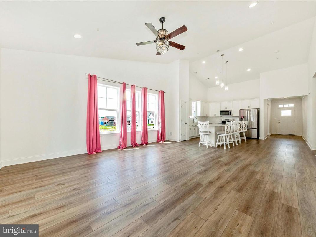 Chandelier, Dining room, Empty room, Interior, Kitchen, Pendant Lights, Recessed Lighting, Stainless Steel Appliances, Wood Texture Flooring