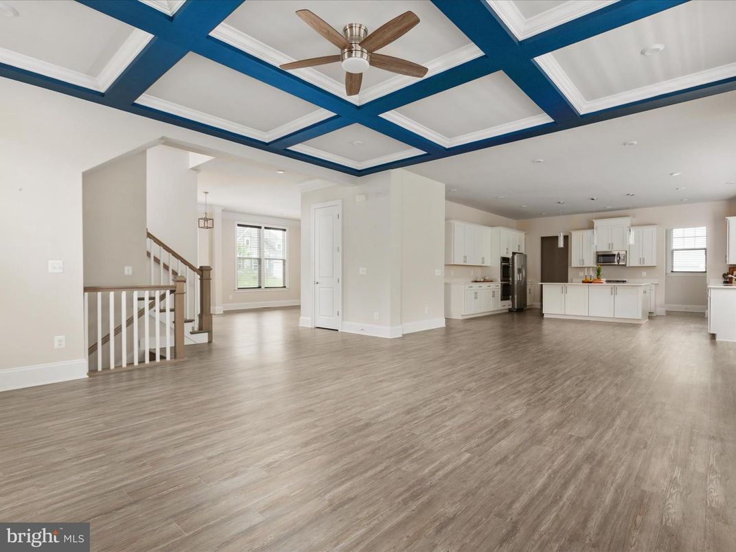 Empty room, Interior, Kitchen, Pendant Lights, Recessed Lighting, Stainless Steel Appliances, Wood Texture Flooring