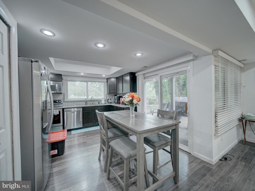 Dining room, Interior, Kitchen, Recessed Lighting, Stainless Steel Appliances, Wood Texture Flooring