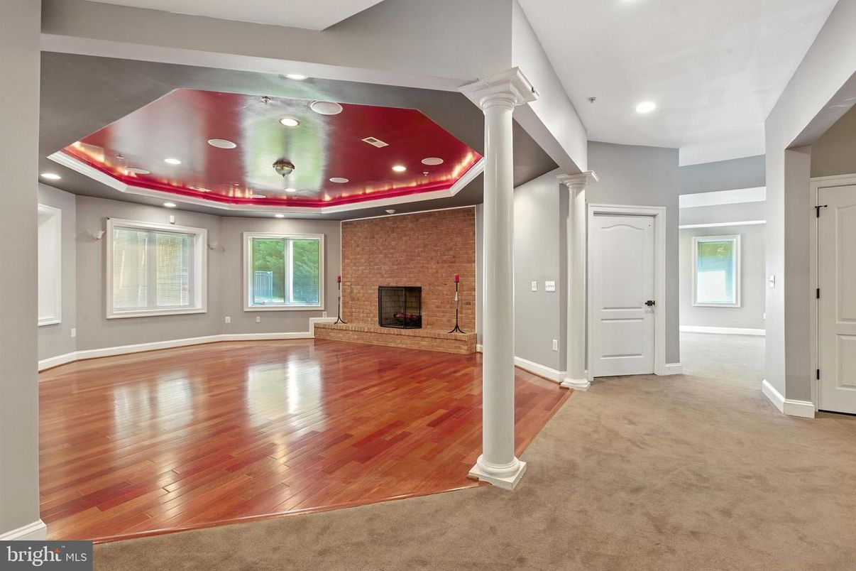 Empty room, Fireplace, Interior, Recessed Lighting, Stone Walls, Wood Texture Flooring