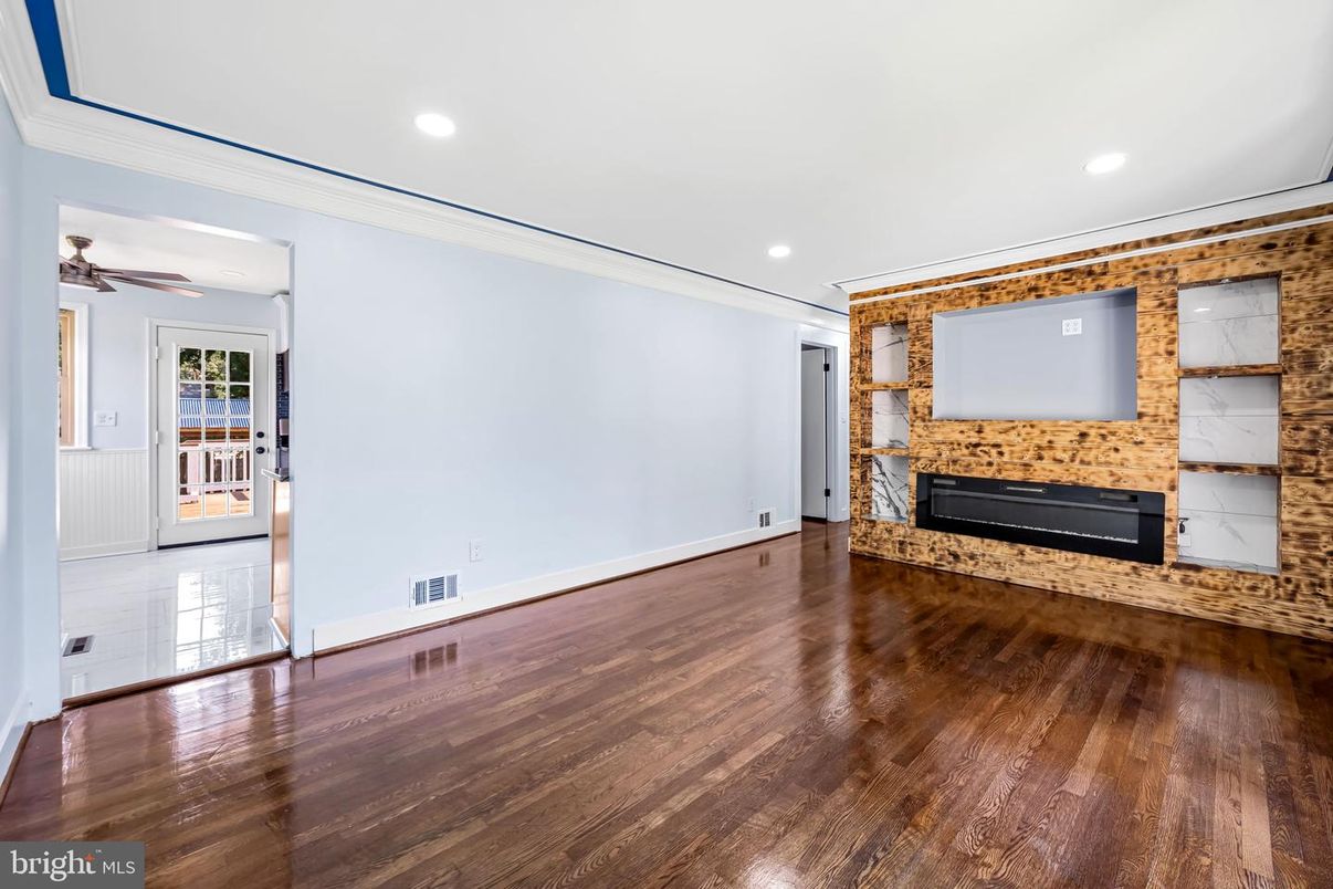 Empty room, Fireplace, Interior, Recessed Lighting, Stone Walls, Wood Texture Flooring