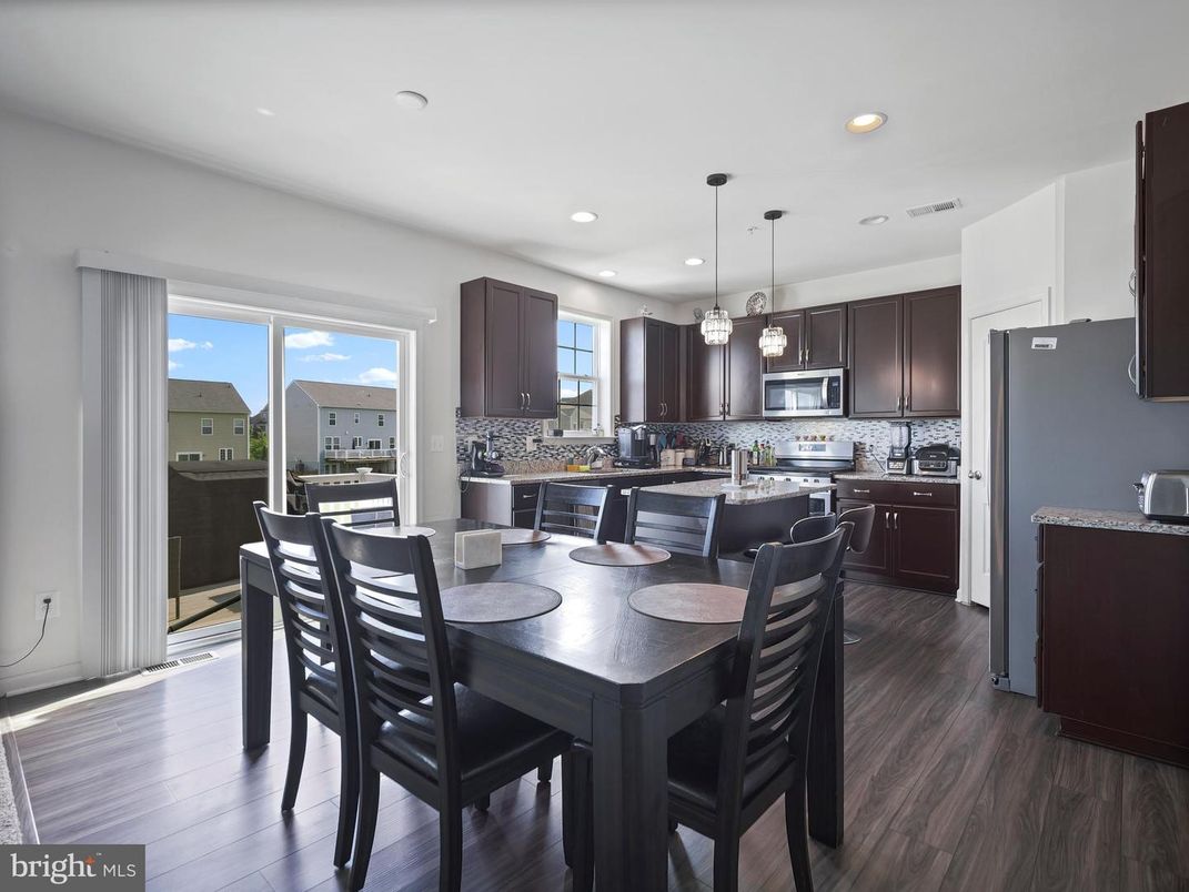 Dining room, Interior, Kitchen, Pendant Lights, Recessed Lighting, Stainless Steel Appliances, Wood Texture Flooring