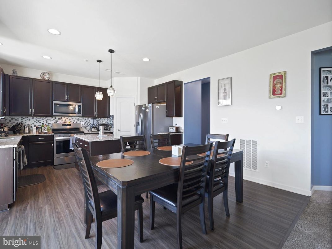 Dining room, Interior, Kitchen, Pendant Lights, Recessed Lighting, Stainless Steel Appliances, Wood Texture Flooring
