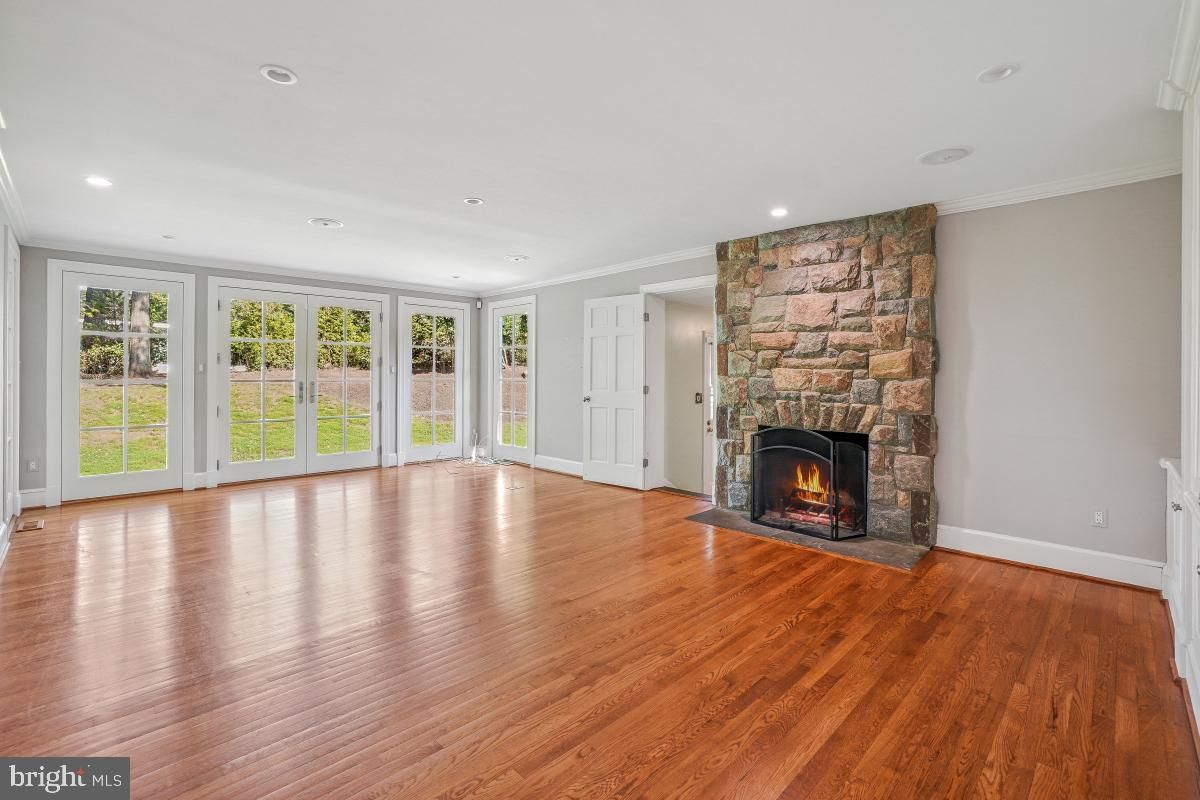 Empty room, Fireplace, Interior, Recessed Lighting, Stone Walls, Wood Texture Flooring
