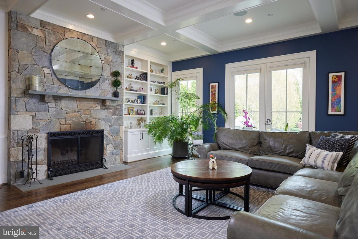 Fireplace, Interior, Living room, Recessed Lighting, Stone Walls, Wood Texture Flooring