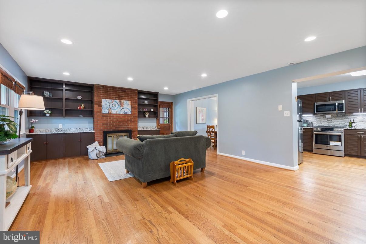 Fireplace, Interior, Kitchen, Living room, Recessed Lighting, Stainless Steel Appliances, Stone Walls, Wood Texture Flooring