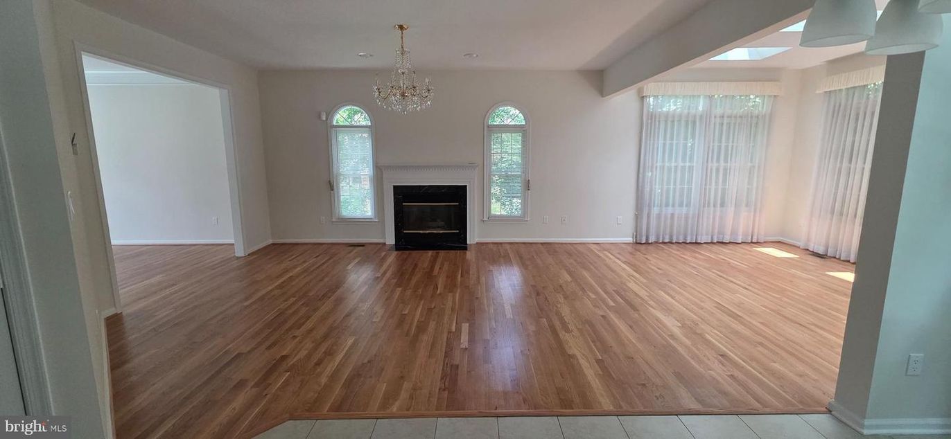 Chandelier, Empty room, Fireplace, Interior, Recessed Lighting, Wood Texture Flooring