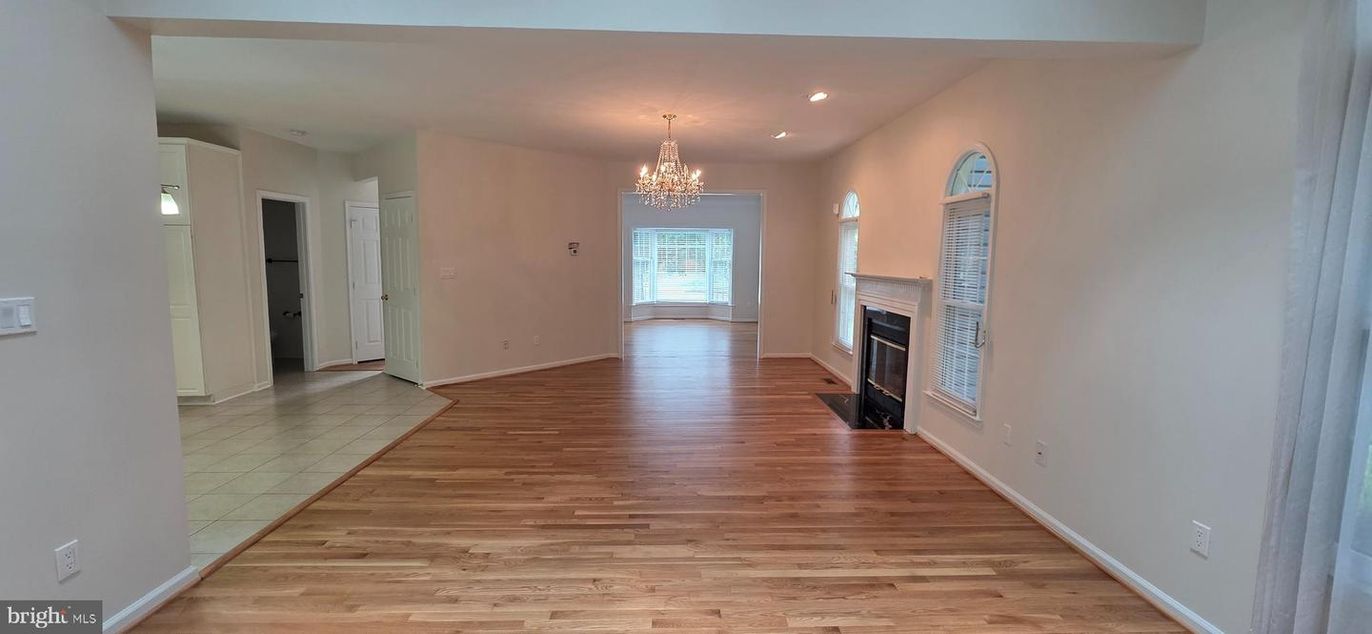 Chandelier, Empty room, Fireplace, Interior, Recessed Lighting, Wood Texture Flooring