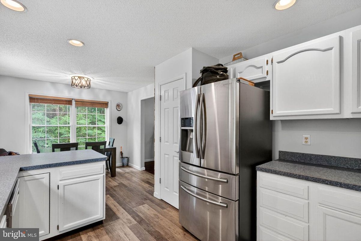 Dining room, Interior, Kitchen, Recessed Lighting, Stainless Steel Appliances, Wood Texture Flooring
