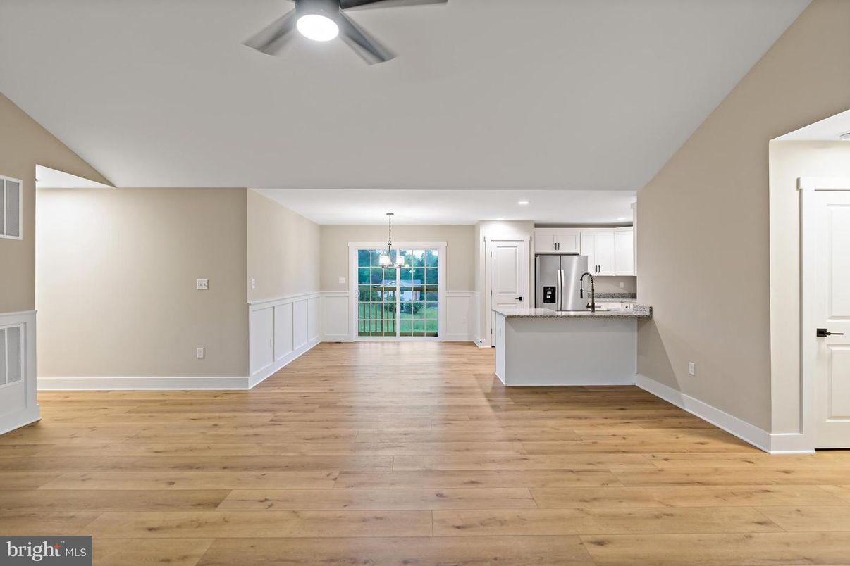 Chandelier, Empty room, Interior, Kitchen, Recessed Lighting, Stainless Steel Appliances, Wood Texture Flooring