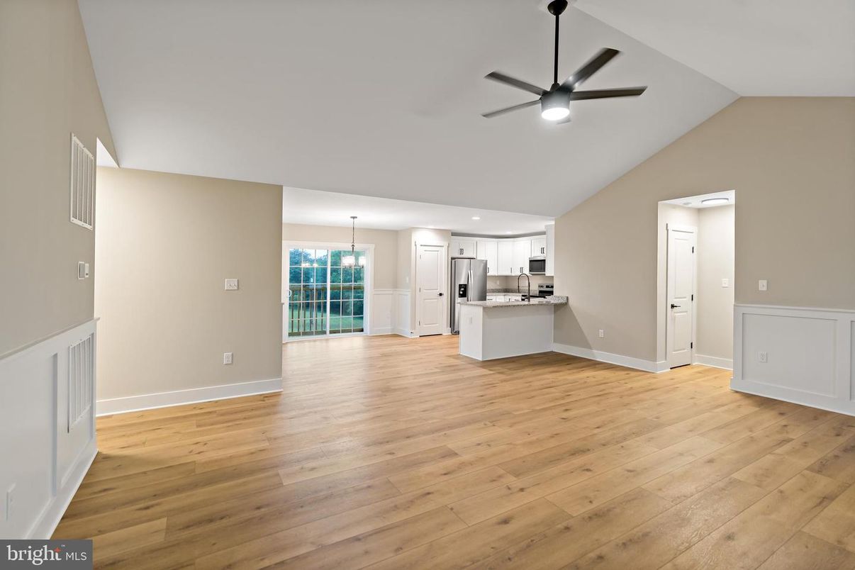 Empty room, Interior, Kitchen, Pendant Lights, Recessed Lighting, Stainless Steel Appliances, Wood Texture Flooring