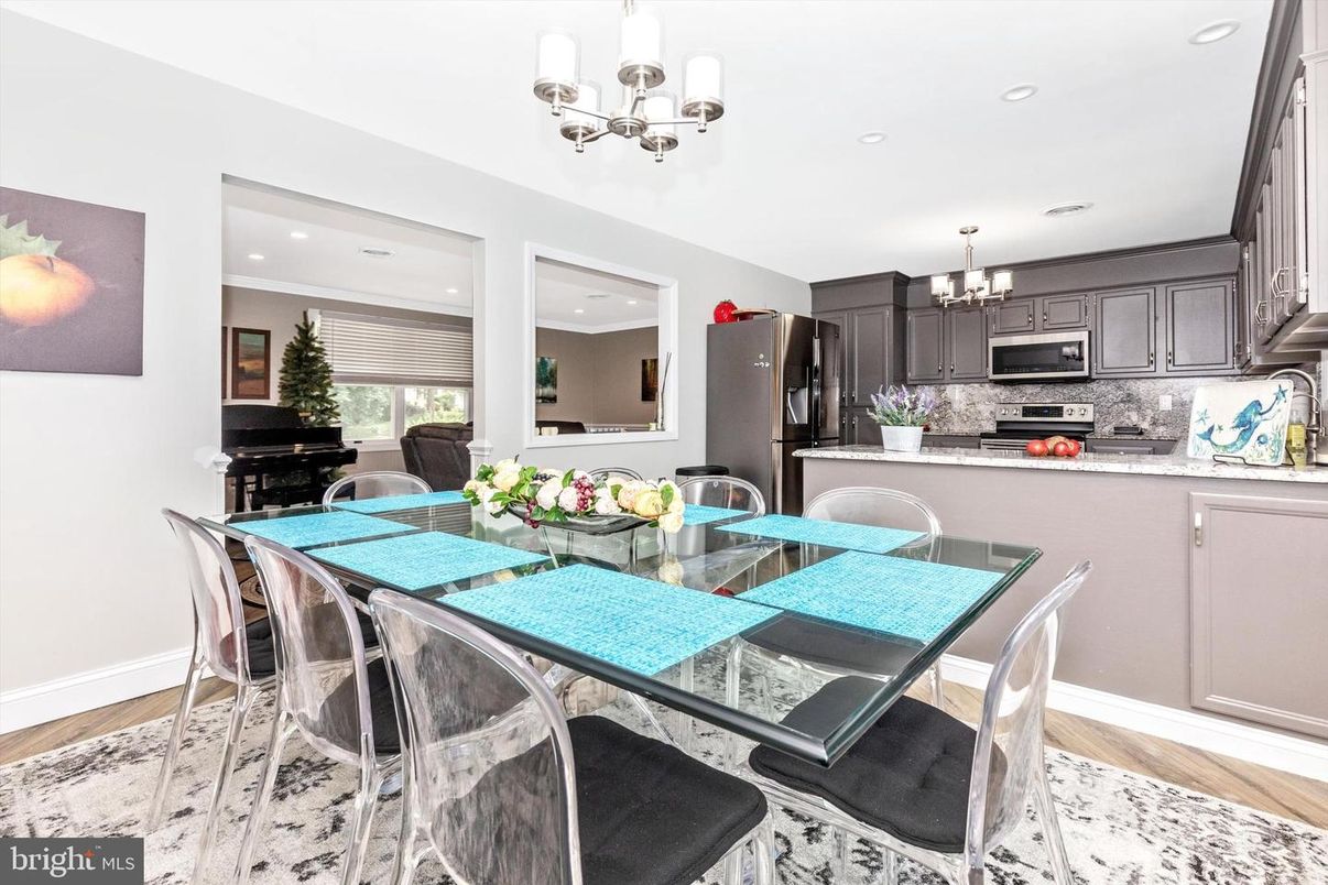 Chandelier, Dining room, Interior, Kitchen, Recessed Lighting, Stainless Steel Appliances, Wood Texture Flooring