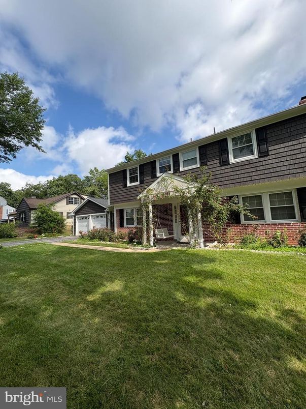 Attached, Backyard, Exterior, Facade, Brick Facade, Raised Ranch
