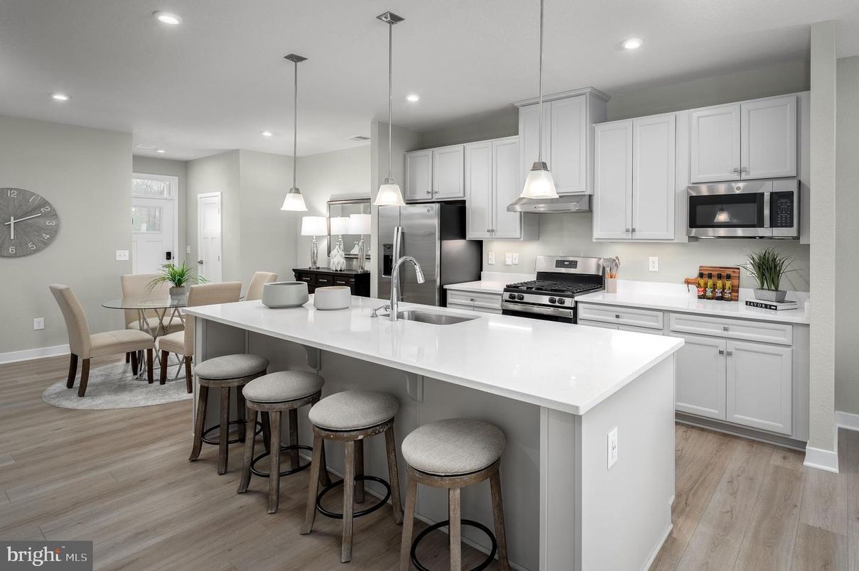 Dining room, Interior, Kitchen, Pendant Lights, Recessed Lighting, Stainless Steel Appliances, Wood Texture Flooring