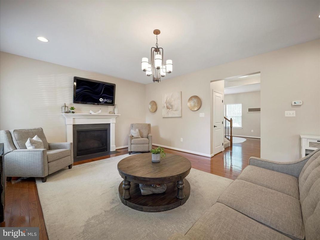 Chandelier, Fireplace, Interior, Living room, Recessed Lighting, Wood Texture Flooring