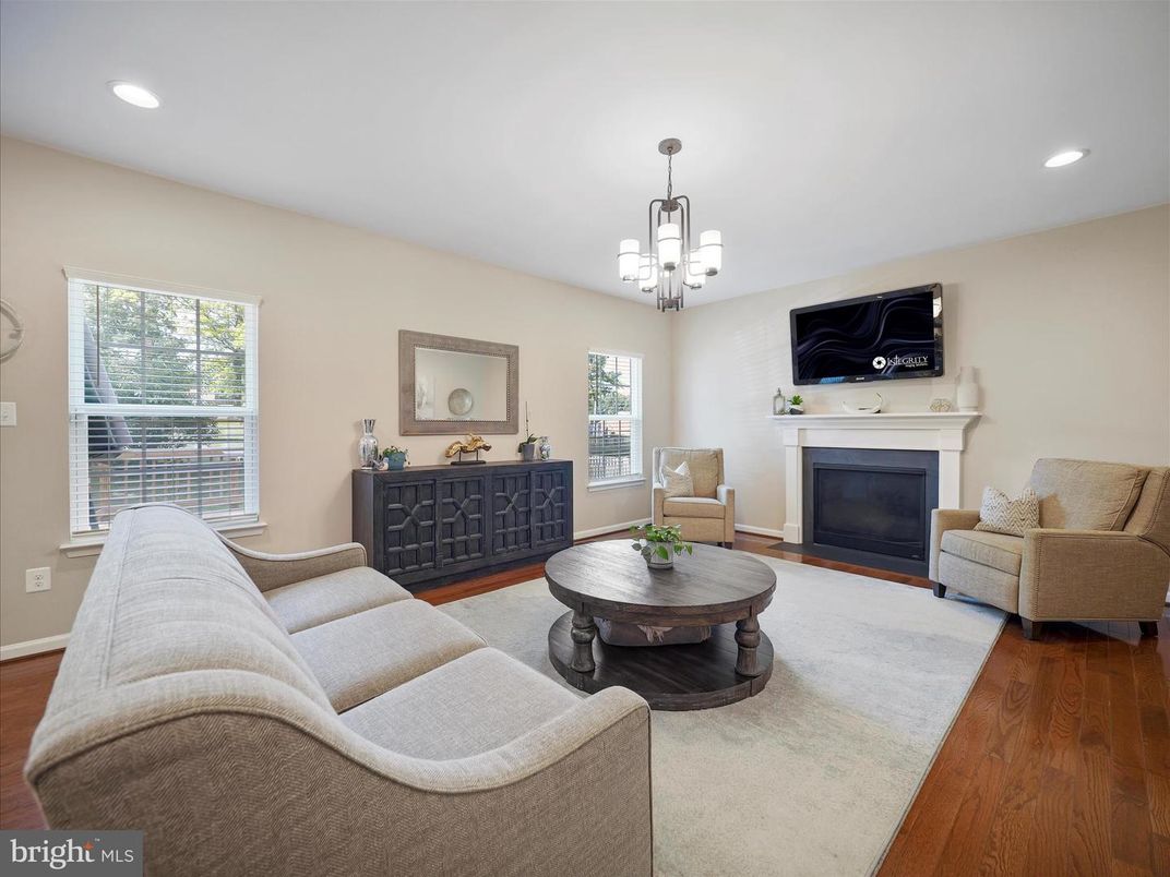 Chandelier, Fireplace, Interior, Living room, Recessed Lighting, Wood Texture Flooring