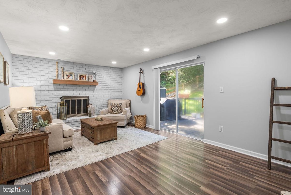 Fireplace, Interior, Living room, Recessed Lighting, Stone Walls, Wood Texture Flooring