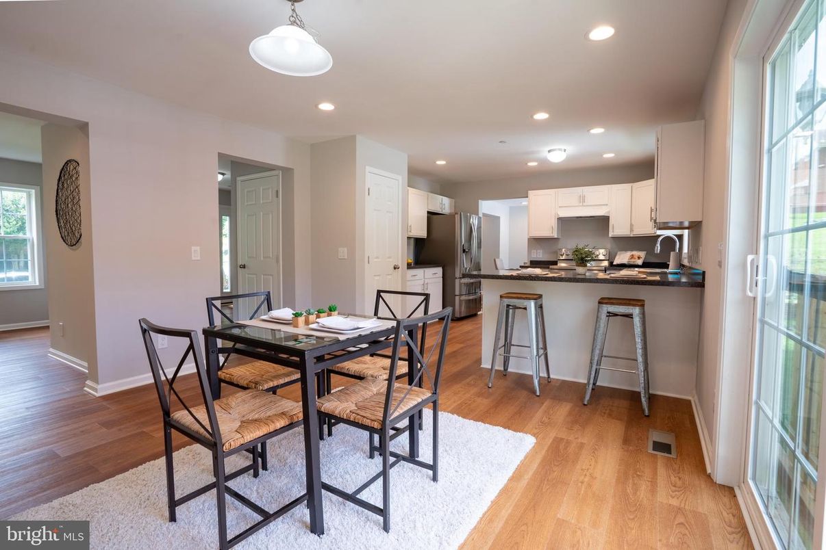 Dining room, Interior, Kitchen, Pendant Lights, Recessed Lighting, Stainless Steel Appliances, Wood Texture Flooring