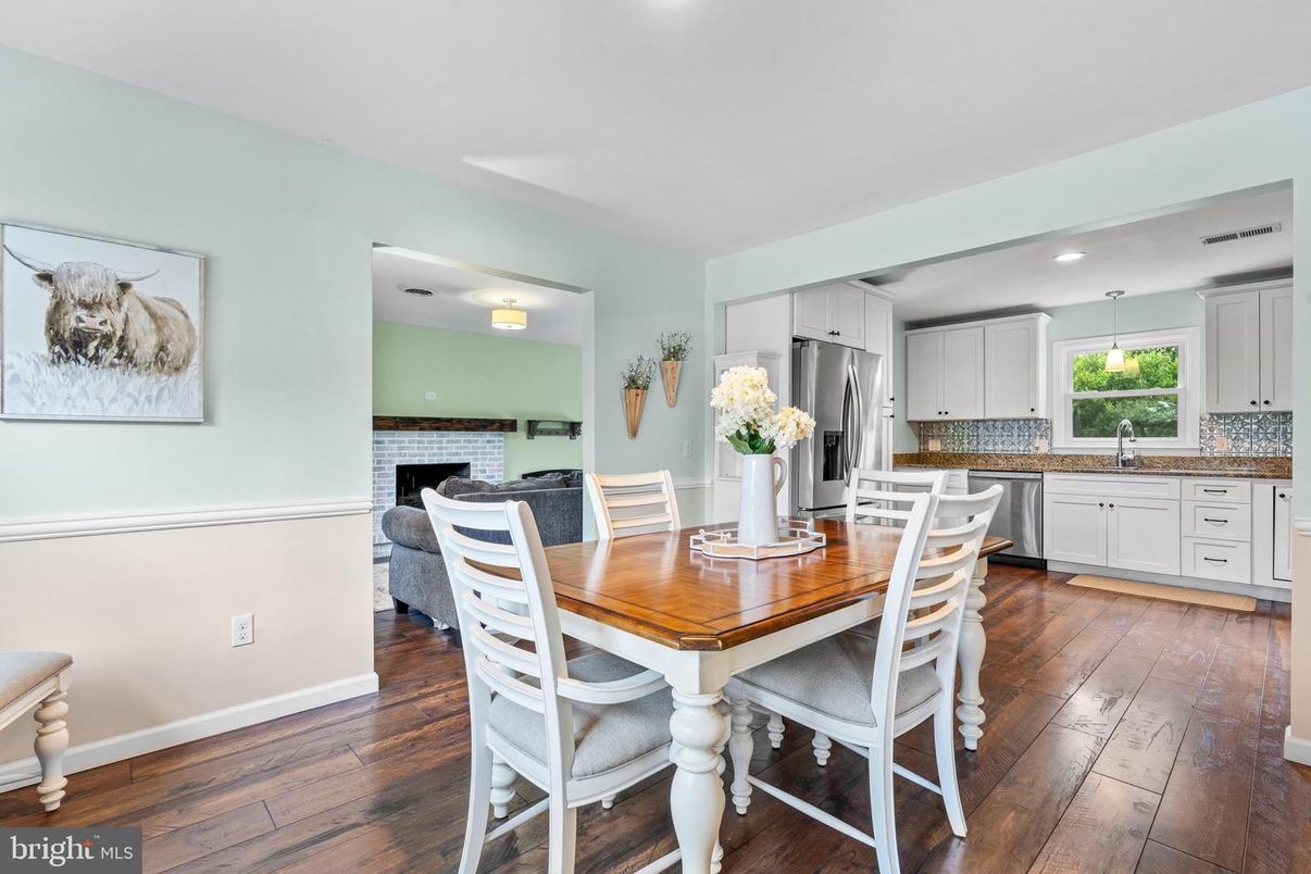 Dining room, Fireplace, Interior, Kitchen, Recessed Lighting, Stainless Steel Appliances, Wood Texture Flooring