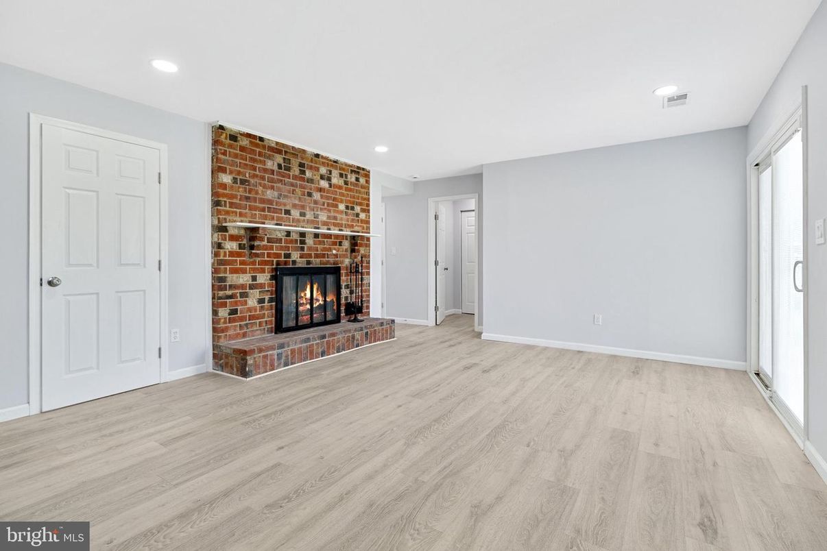Empty room, Fireplace, Interior, Recessed Lighting, Stone Walls, Wood Texture Flooring