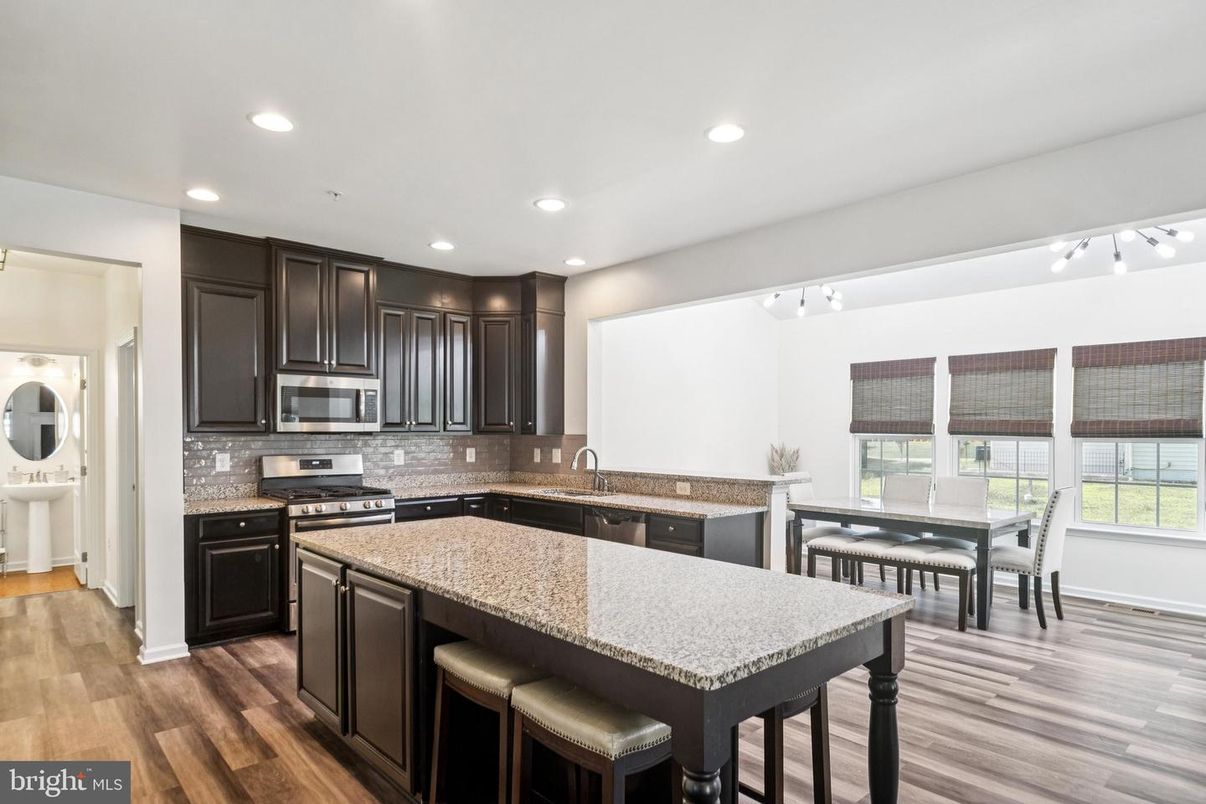 Dining room, Interior, Kitchen, Recessed Lighting, Stainless Steel Appliances, Wood Texture Flooring