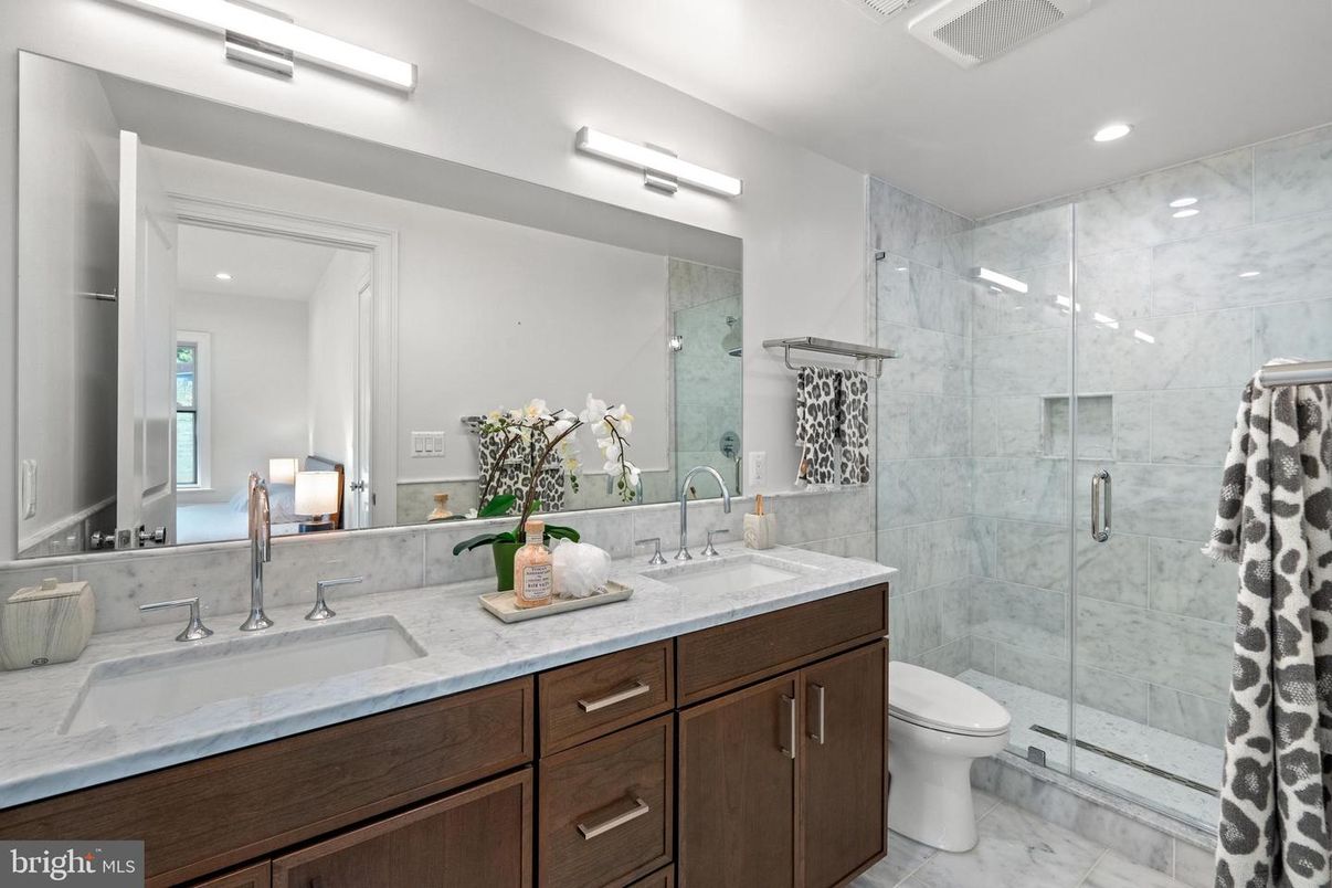 Bathroom, Dual Sink Vanities, Glass Shower, Interior, Marble, Marble Walls, Recessed Lighting