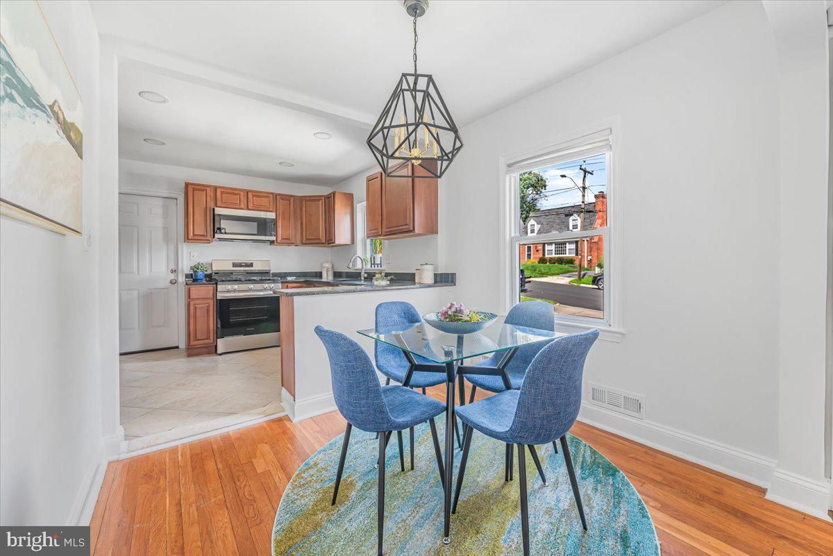 Dining room, Interior, Kitchen, Pendant Lights, Recessed Lighting, Stainless Steel Appliances, Wood Texture Flooring