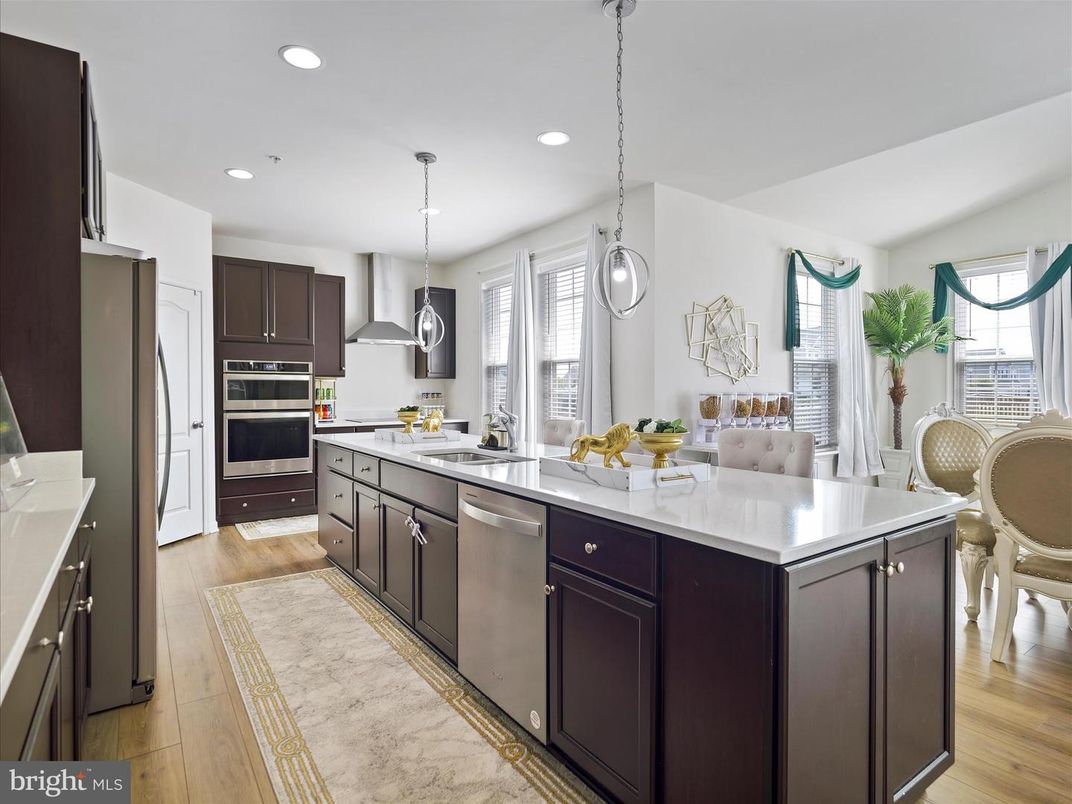 Dining room, Interior, Kitchen, Pendant Lights, Recessed Lighting, Stainless Steel Appliances, Wood Texture Flooring