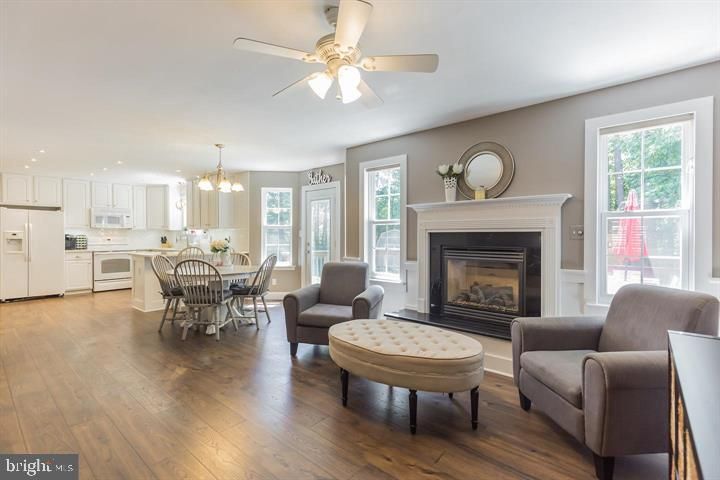 Chandelier, Dining room, Fireplace, Interior, Kitchen, Recessed Lighting, Wood Texture Flooring