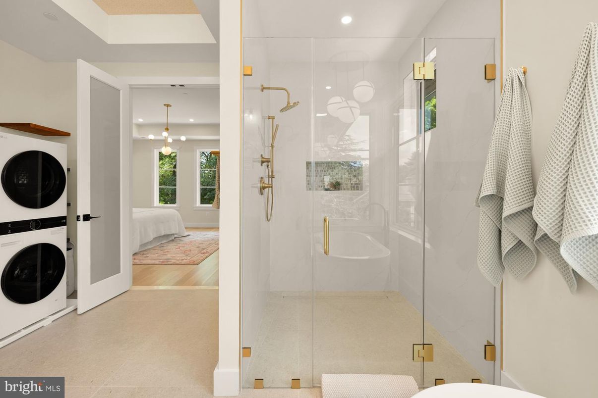 Bathroom, Glass Shower, Interior, Pendant Lights, Recessed Lighting, Washer, Wood Texture Flooring