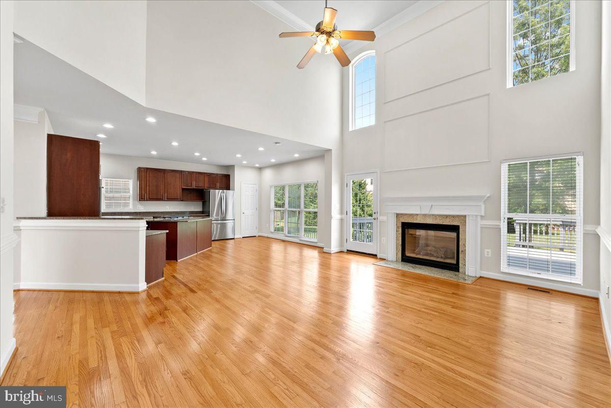 Fireplace, Interior, Kitchen, Recessed Lighting, Stainless Steel Appliances, Wood Texture Flooring