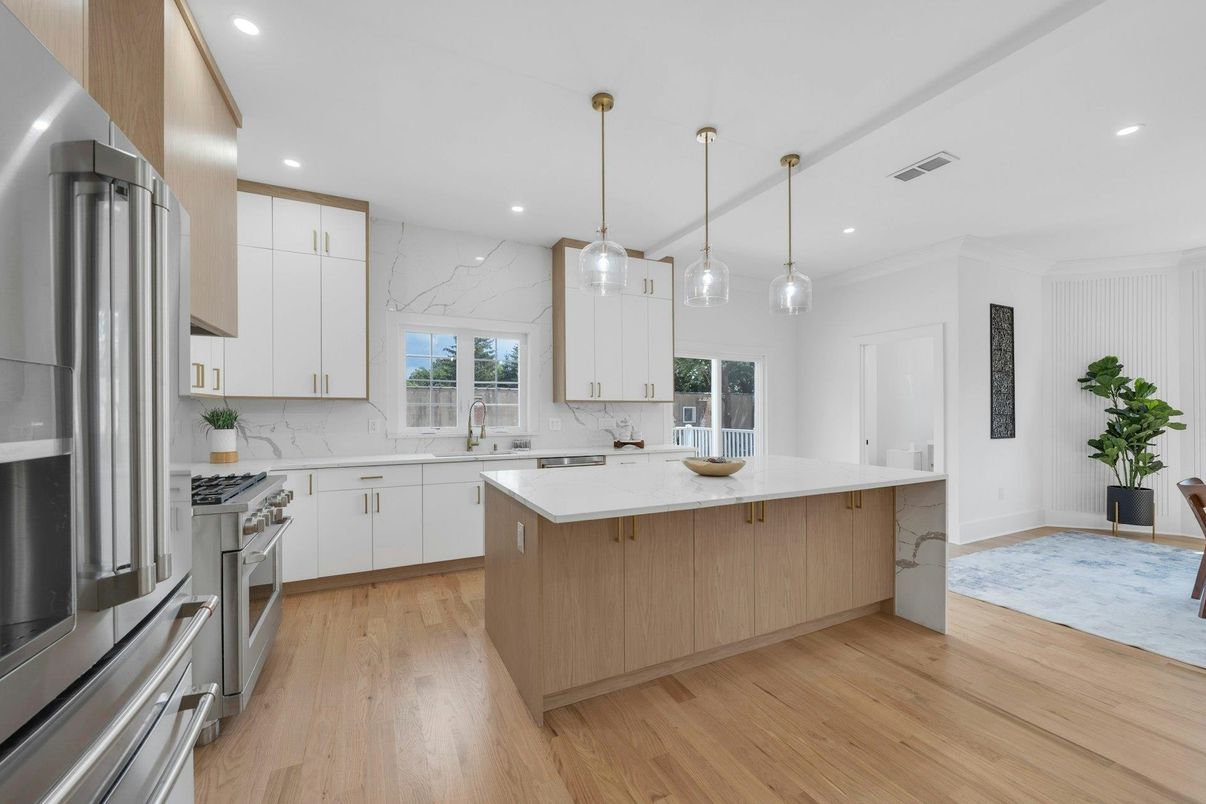 Interior, Kitchen, Marble Walls, Pendant Lights, Recessed Lighting, Stainless Steel Appliances, Wood Texture Flooring