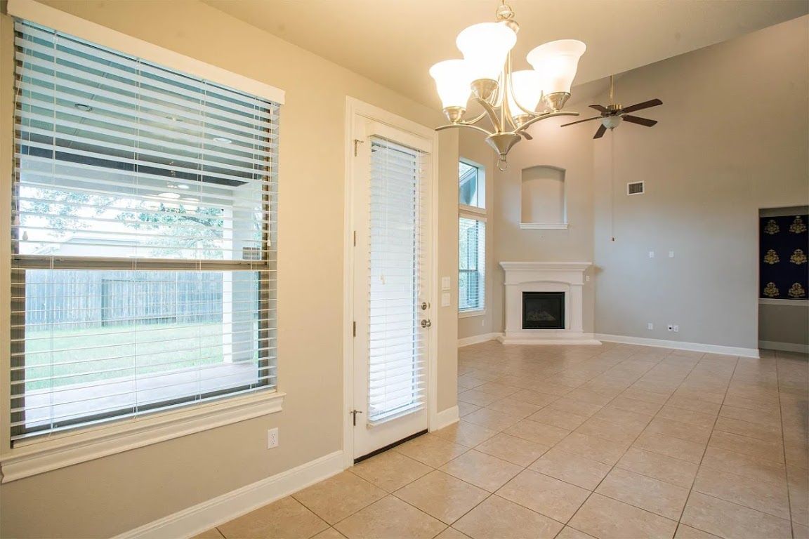 Chandelier, Empty room, Fireplace, Interior