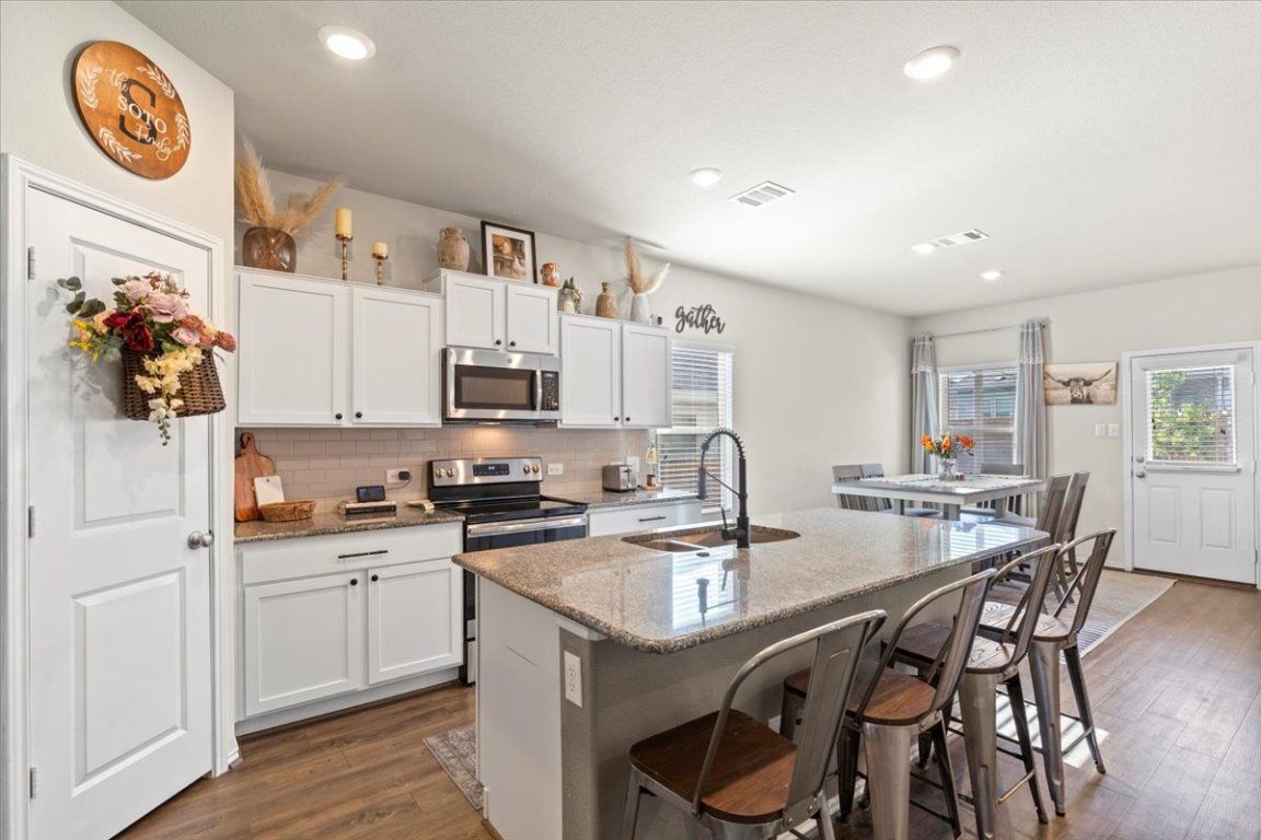 Dining room, Interior, Kitchen, Recessed Lighting, Stainless Steel Appliances, Wood Texture Flooring