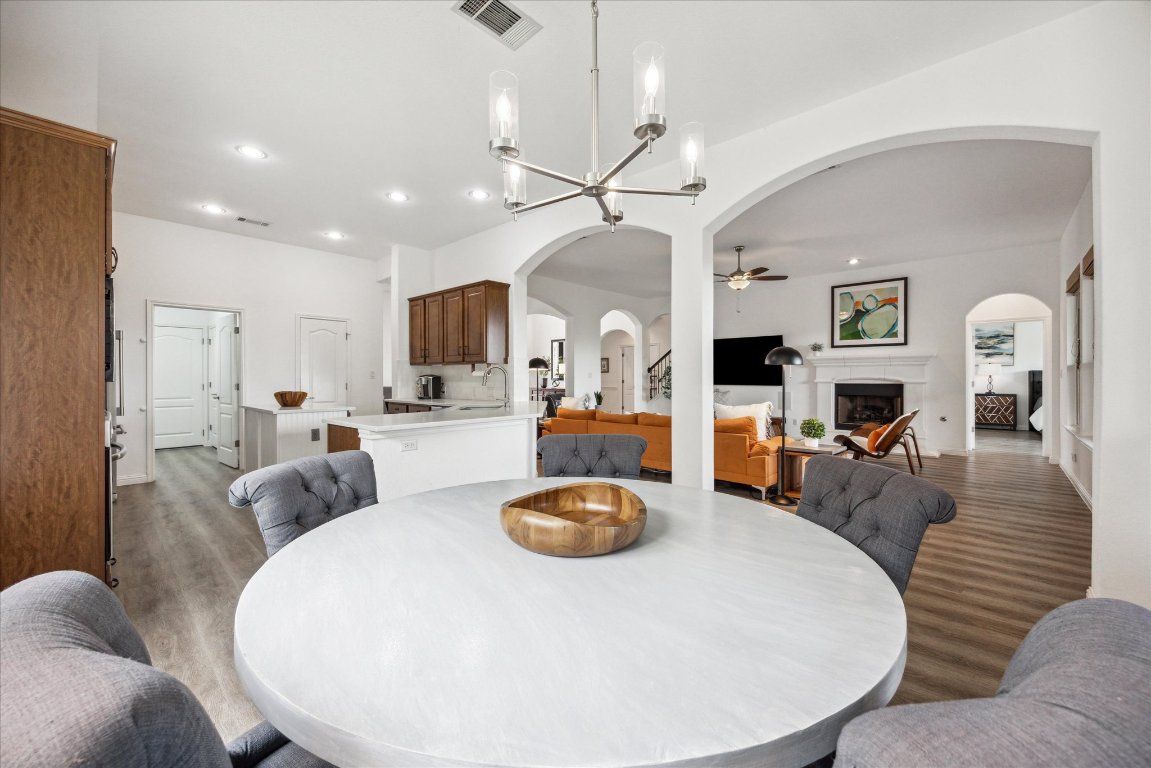 Dining room, Fireplace, Interior, Kitchen, Living room, Pendant Lights, Recessed Lighting, Wood Texture Flooring