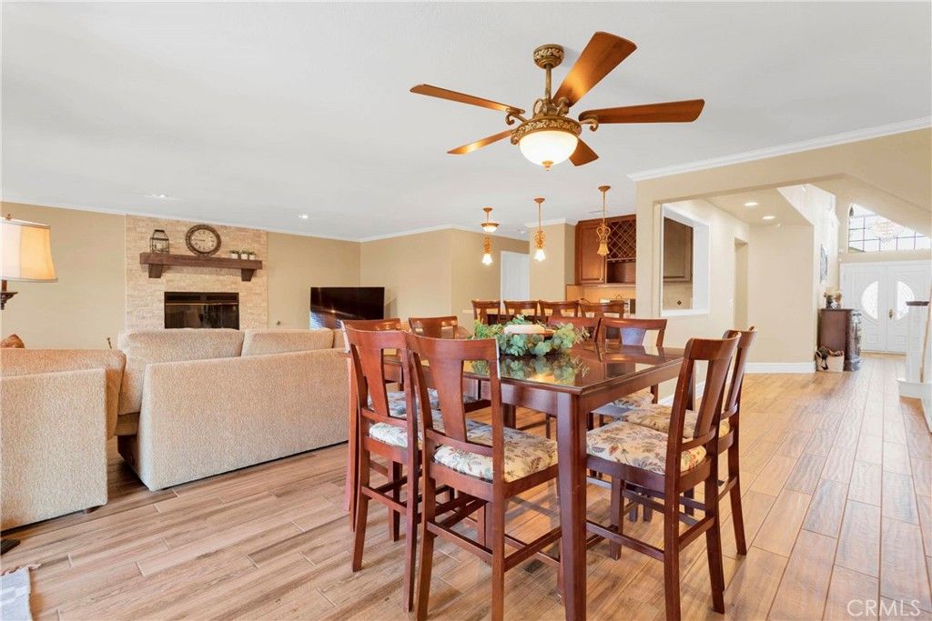 Dining room, Fireplace, Interior, Living room, Pendant Lights, Recessed Lighting, Stone Walls, Wood Texture Flooring