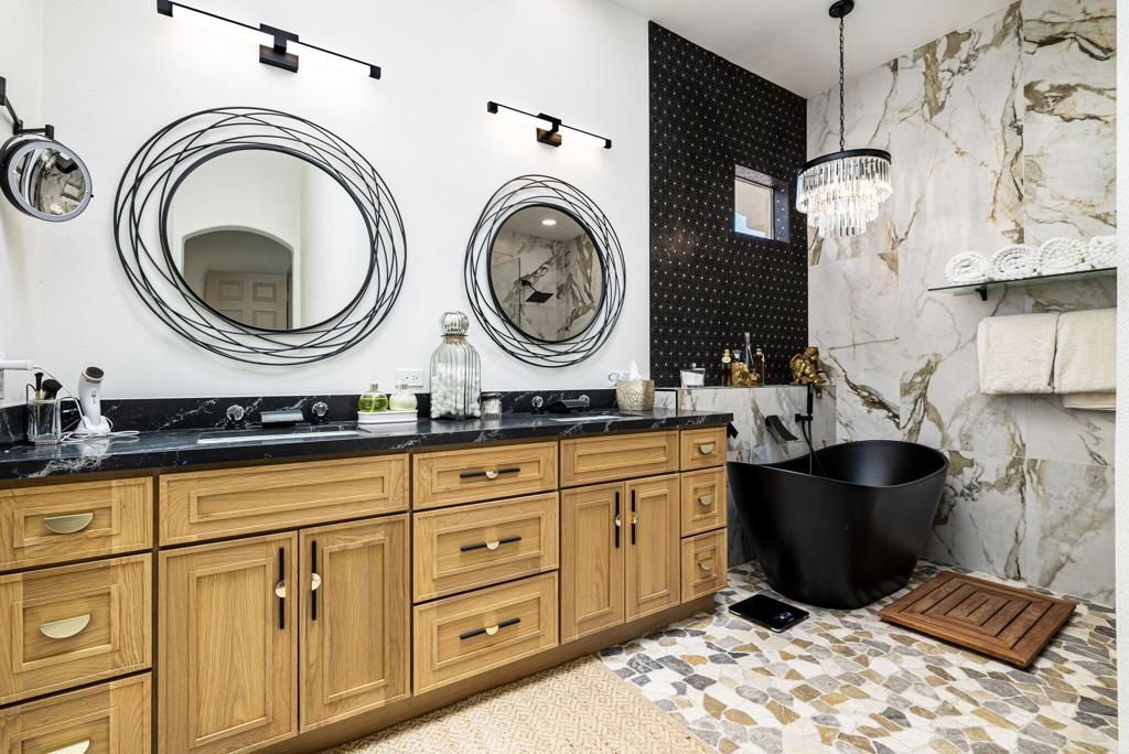 Bathroom, Chandelier, Dual Sink Vanities, Free Standing Baths, Interior, Marble Walls, Pendant Lights