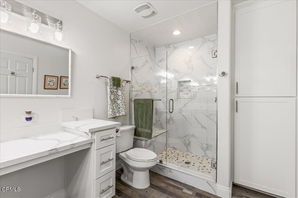 Bathroom, Glass Shower, Interior, Marble Walls, Recessed Lighting, Wood Texture Flooring