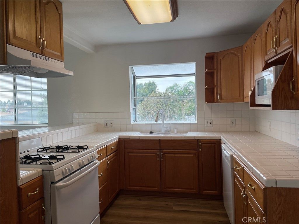 Interior, Kitchen, Tile Countertops, Wood Texture Flooring
